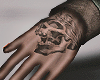 skulls hand tattoo